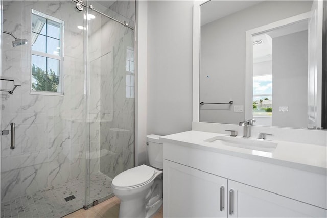 129 Strand Dr, Vero Beach, FL 32963 - bathroom with toilet, a marble finish shower, and vanity