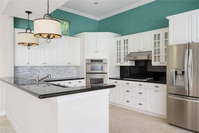 8455 Bay Leaf Ln Unit 11, Vero Beach, FL 32963 - kitchen featuring appliances with stainless steel finishes, under cabinet range hood, tasteful backsplash, light tile patterned floors, and white cabinets