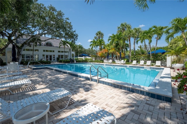 8455 Bay Leaf Ln Unit 11, Vero Beach, FL 32963 - community pool featuring a patio area