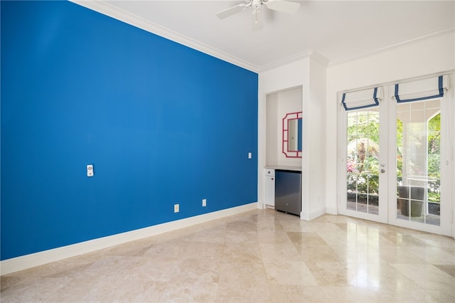 8455 Bay Leaf Ln Unit 11, Vero Beach, FL 32963 - spare room with crown molding, ceiling fan, and baseboards