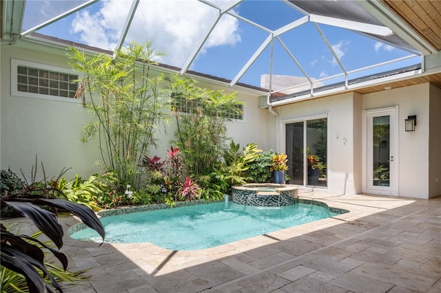8455 Bay Leaf Ln Unit 11, Vero Beach, FL 32963 - view of swimming pool featuring a patio area, glass enclosure, and a pool with connected hot tub