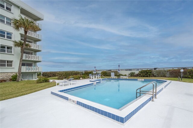 view of pool featuring a patio area