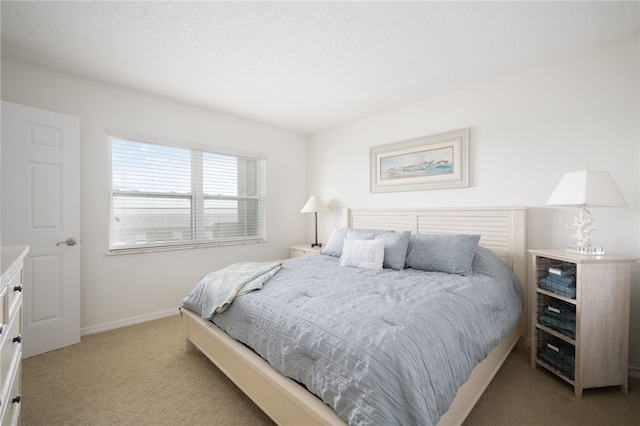 bedroom with light colored carpet