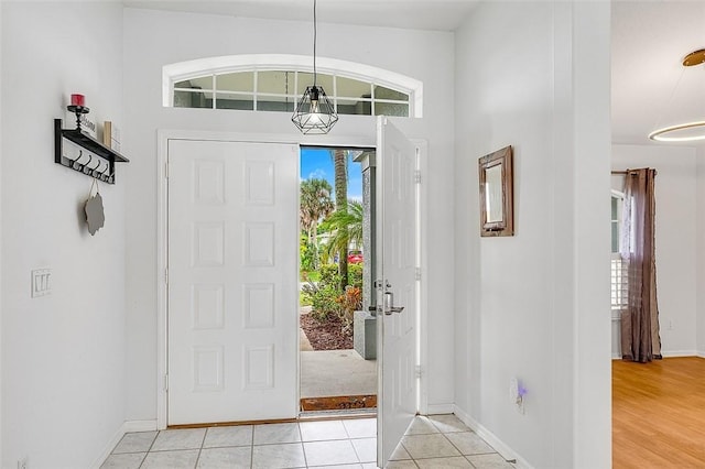 entryway featuring light tile patterned floors