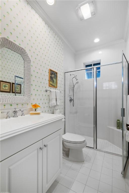 425 Indies Dr, Vero Beach, FL 32963 - full bathroom with toilet, a stall shower, visible vents, vanity, and ornamental molding