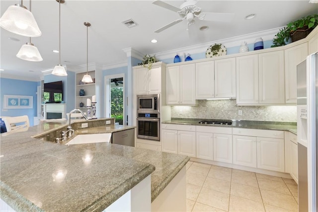 425 Indies Dr, Vero Beach, FL 32963 - kitchen with a sink, visible vents, backsplash, a ceiling fan, and appliances with stainless steel finishes