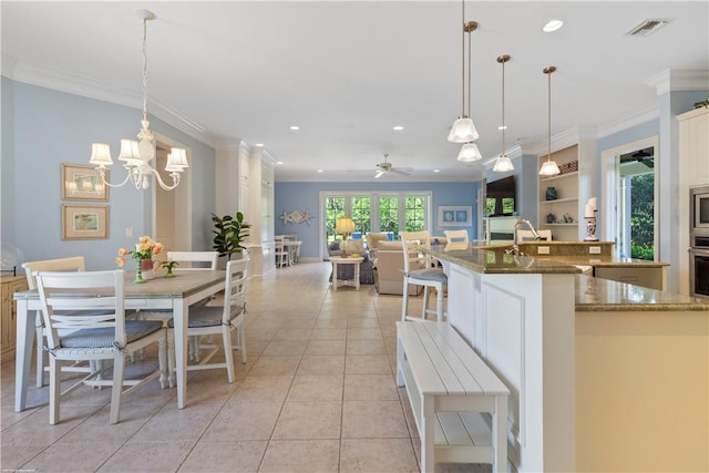 425 Indies Dr, Vero Beach, FL 32963 - kitchen featuring visible vents, crown molding, stainless steel appliances, and a sink