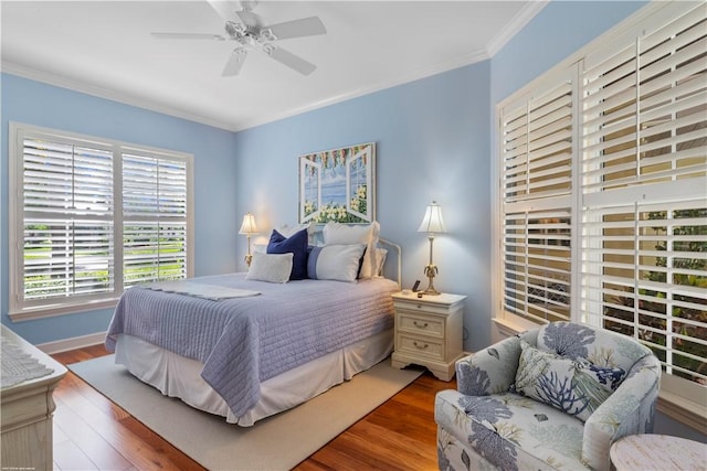 425 Indies Dr, Vero Beach, FL 32963 - bedroom featuring wood finished floors, crown molding, baseboards, and a ceiling fan