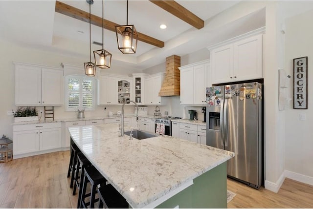 kitchen featuring stainless steel appliances, sink, and white cabinets