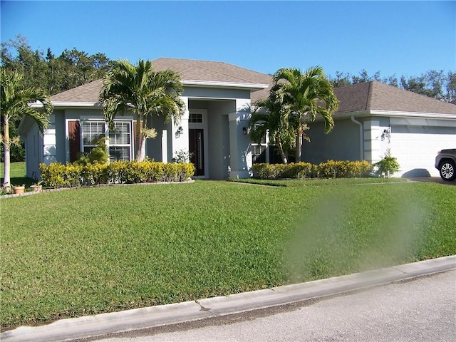 ranch-style house with a front lawn, a garage, and stucco siding