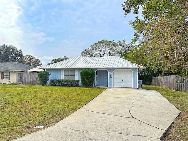 single story home featuring a front yard and a garage