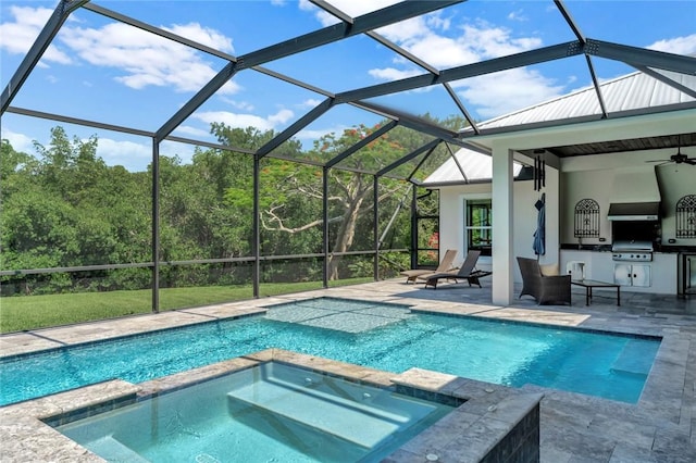 710 Canoe Trl, Vero Beach, FL 32963 - view of pool with a ceiling fan, a patio, a pool with connected hot tub, and glass enclosure
