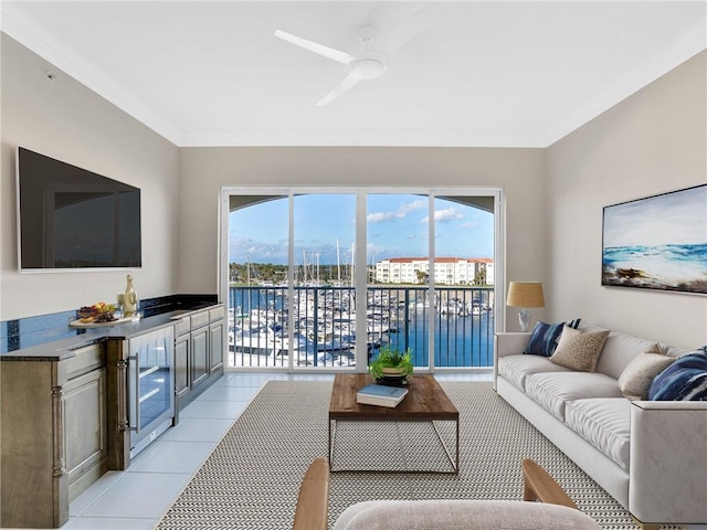 living room featuring ceiling fan, light tile patterned floors, a water view, bar area, and wine cooler