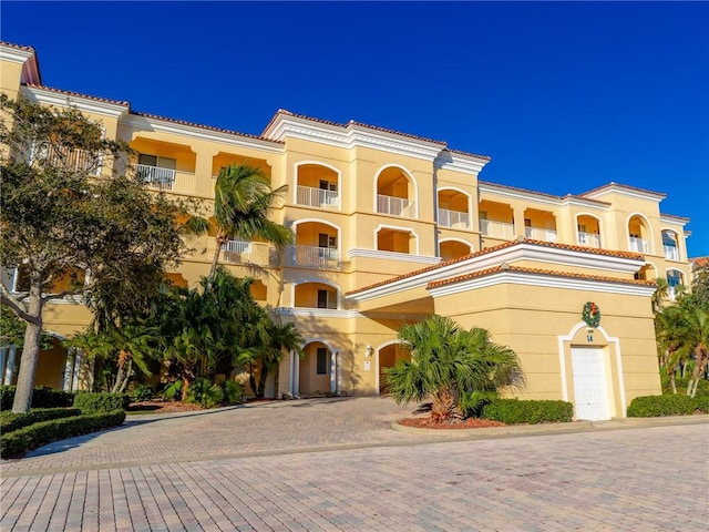 view of front of home with a balcony