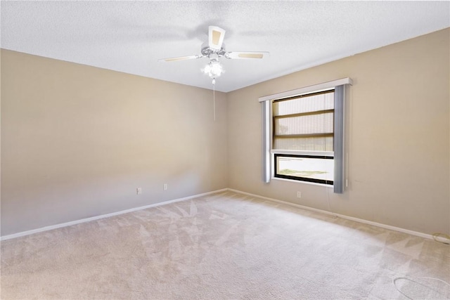 unfurnished room with light carpet, a textured ceiling, and ceiling fan