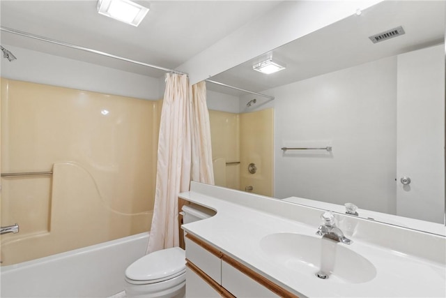 full bathroom with shower / bath combo, vanity, and toilet