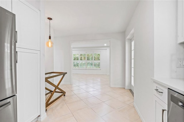 kitchen with pendant lighting and white cabinets