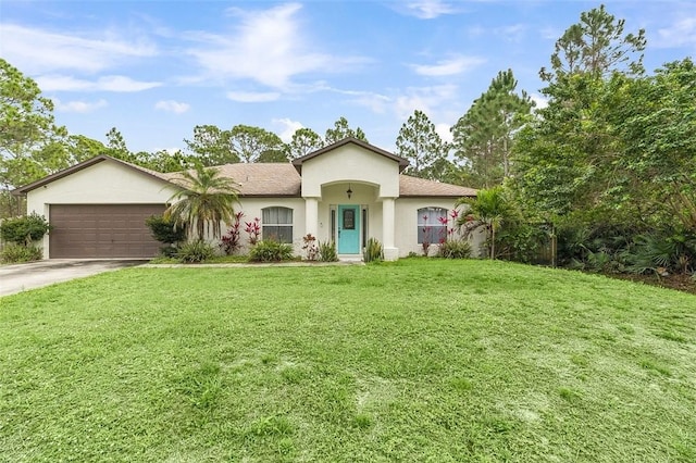 view of front of property featuring driveway, a garage, a front lawn, and stucco siding