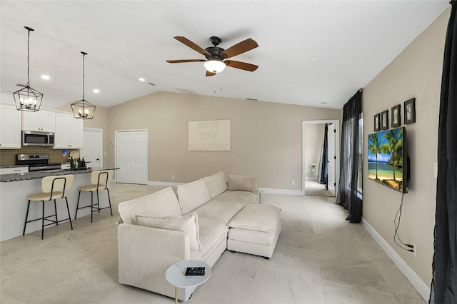 living room with lofted ceiling, baseboards, and a ceiling fan