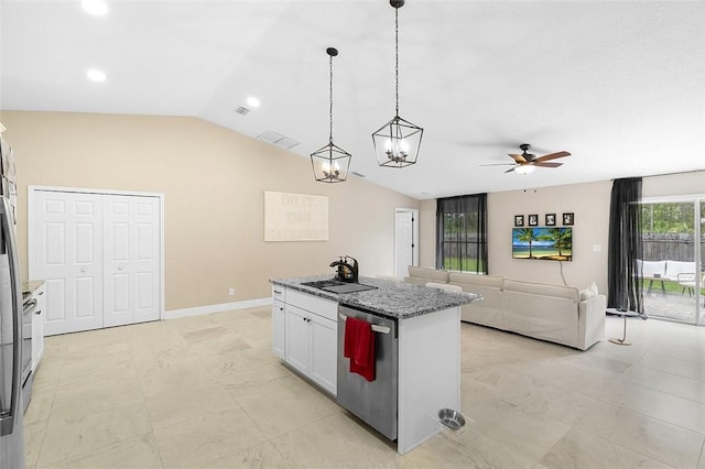 kitchen featuring lofted ceiling, a kitchen island, stainless steel dishwasher, white cabinetry, and a sink