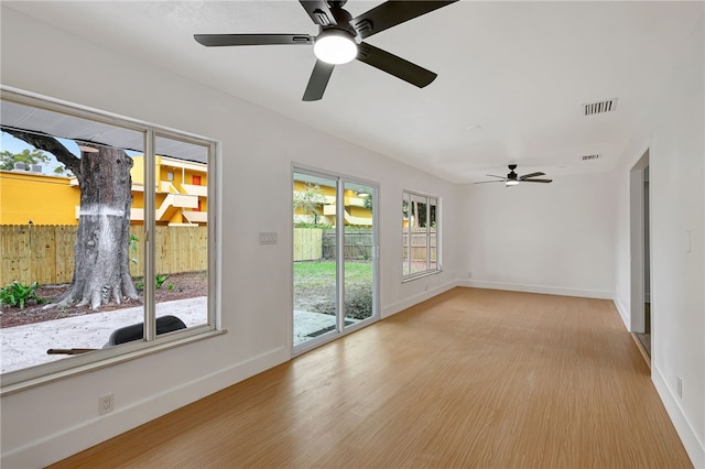 unfurnished room featuring ceiling fan and light hardwood / wood-style floors