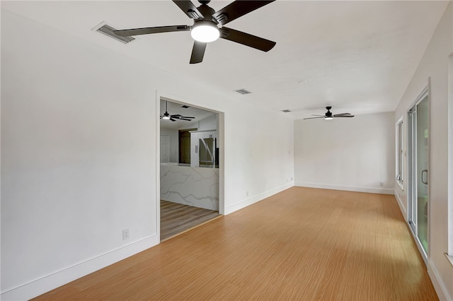 spare room with light hardwood / wood-style floors