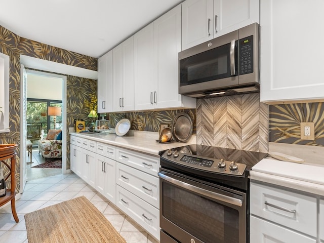 kitchen with white cabinetry and appliances with stainless steel finishes