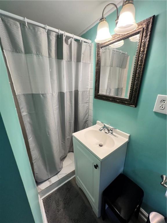 bathroom with vanity and walk in shower