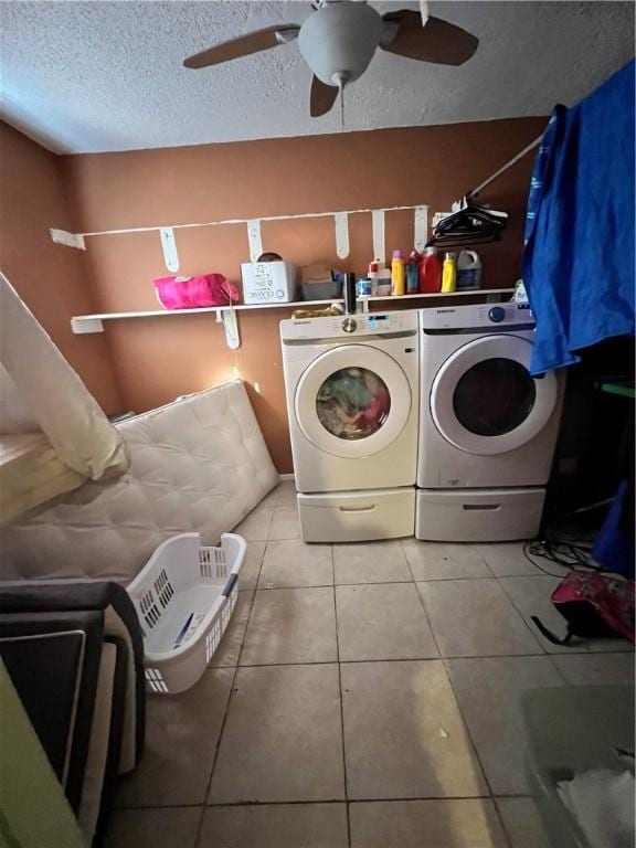 washroom with tile patterned floors, ceiling fan, a textured ceiling, and independent washer and dryer