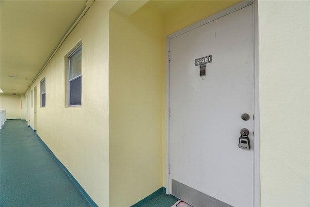 doorway to property with stucco siding