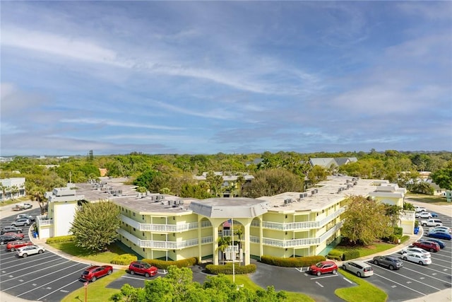 view of property featuring uncovered parking