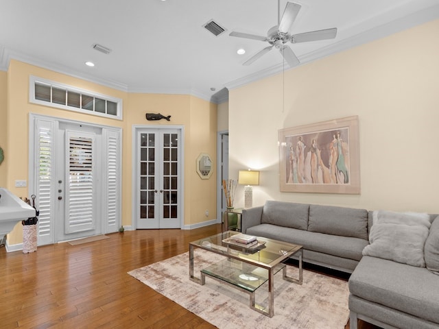 living room with french doors, light hardwood / wood-style floors, sink, ornamental molding, and ceiling fan