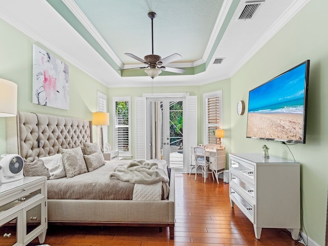 bedroom with dark wood-type flooring, access to outside, ceiling fan, and crown molding