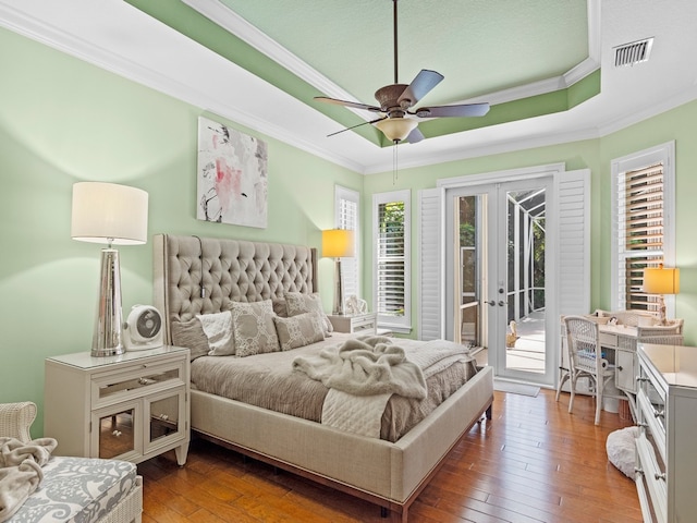 bedroom featuring access to outside, french doors, crown molding, dark hardwood / wood-style flooring, and ceiling fan