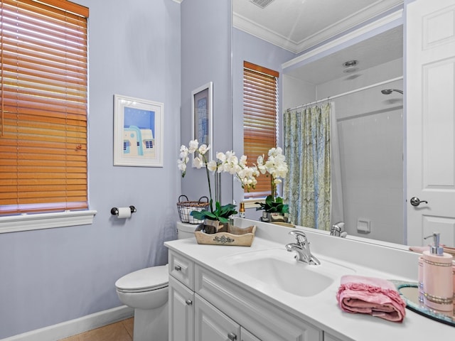 bathroom with a healthy amount of sunlight, toilet, tile patterned flooring, vanity, and crown molding