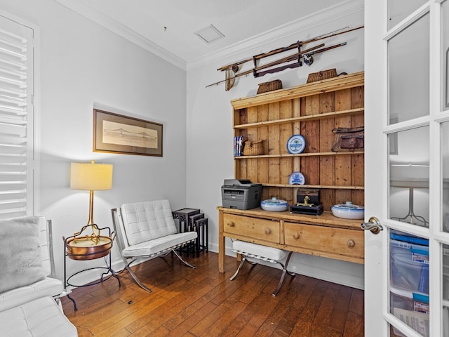 living area with dark hardwood / wood-style flooring and ornamental molding