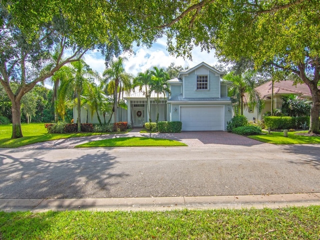 view of front facade with a garage and a front yard