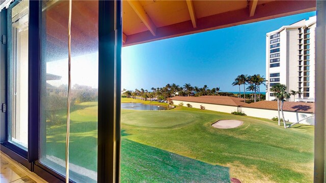 exterior space featuring beam ceiling and a water view