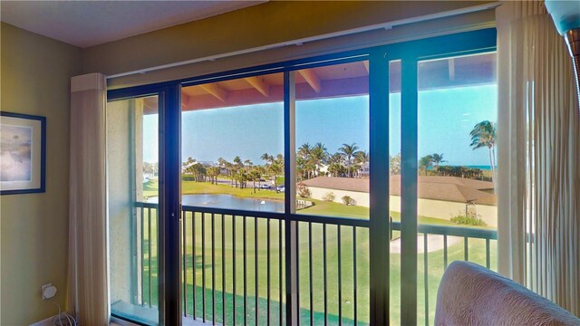 doorway featuring a wealth of natural light and a water view