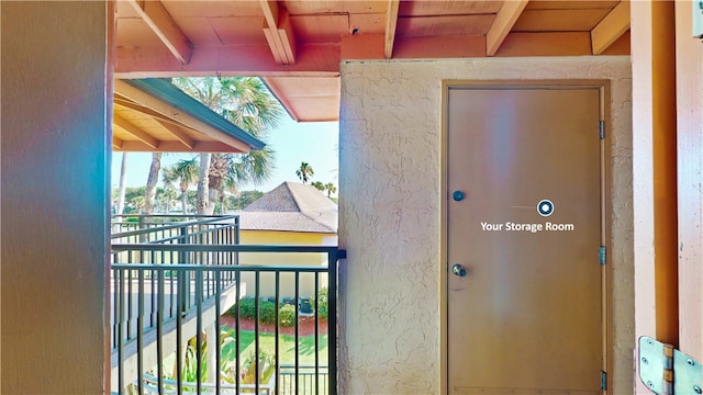 entrance to property with a balcony