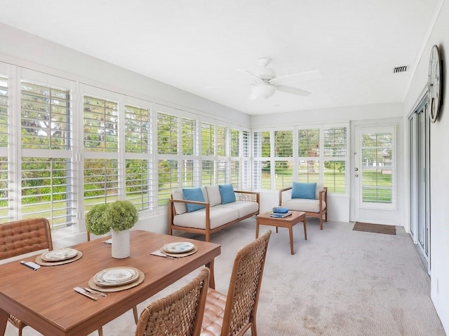 sunroom with ceiling fan