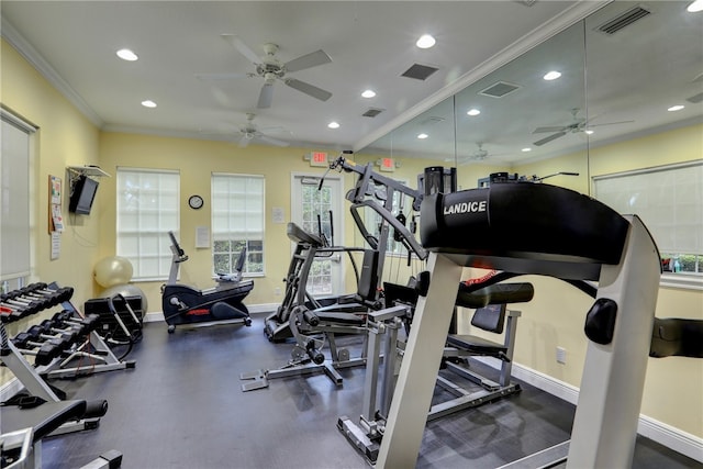 gym with ceiling fan and crown molding