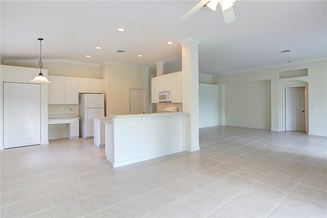 kitchen featuring white cabinets, ornamental molding, light tile patterned flooring, and white appliances