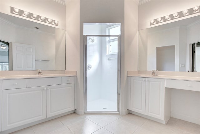 bathroom with walk in shower, ornamental molding, tile patterned floors, and vanity