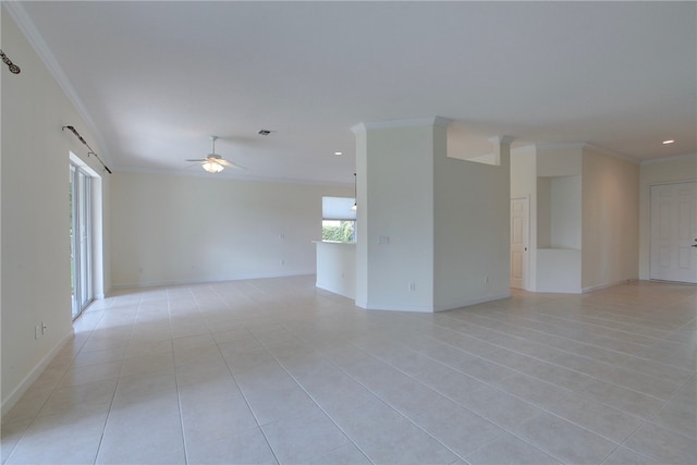 tiled spare room with ceiling fan and ornamental molding