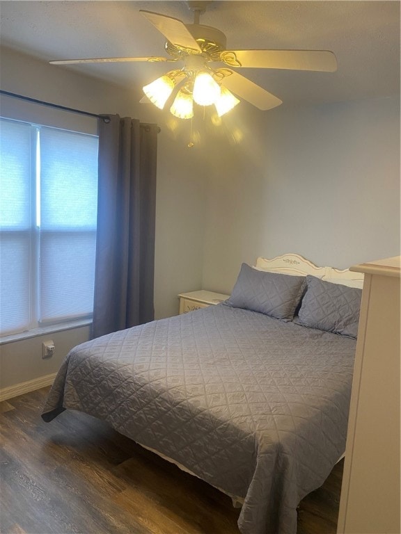 bedroom with hardwood / wood-style flooring and ceiling fan