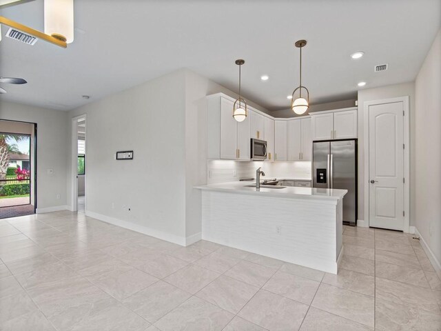 bedroom featuring light carpet and a raised ceiling