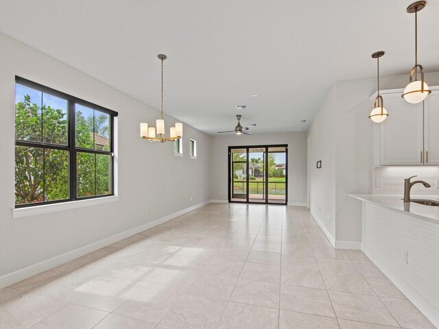 tiled dining area featuring ceiling fan