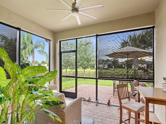 sunroom / solarium with ceiling fan