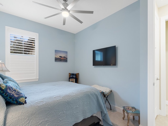 bedroom with ceiling fan and carpet flooring